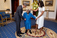 President Barack Obama and First Lady Michelle Obama greet 106-Year-Old Virginia McLaurin during a photo line in the Blue Room of the White House prior to a reception celebrating African American History Month, Feb. 18, 2016.