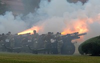 Bravo Battery, 2nd Battalion, 2nd Field Artillery "Salute Battery" fires cannons during the 77th Army Band's rendition of Tchaikovsky's "1812 Overture" and to honor each state's entry into the Union during the Independence Day celebration, June 30, 2016 at post headquarters, McNair Hall, Fort Sill, Oklahoma. Original public domain image from Flickr
