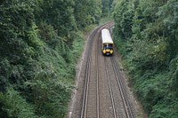 Moving train on a track. Free public domain CC0 photo.