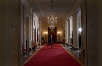 President Barack Obama walks to a podium in the Cross Hall, Grand Foyer of the White House, before making a statement regarding the American auto industry, March 30, 2009.