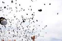 Graduates toss their hats into the air at the end of the United States Naval Academy graduation ceremony May 22, 2009.