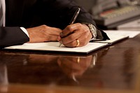 President Barack Obama signs the Federal Benefits & Non-Discrimination memorandum in the Oval Office, June 17, 2009.