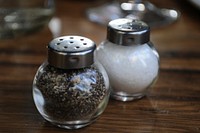 Salt and pepper shakers at cafe. Free public domain CC0 image.