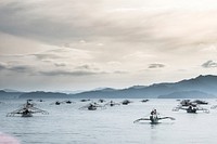 Tourist boats queue up off Sabong Beach, Palawan, Philippines. Free public domain CC0 photo.