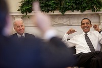 President Barack Obama and Vice President Joe Biden react during a lighter moment at the daily economic briefing in the Oval Office on July 30, 2009.