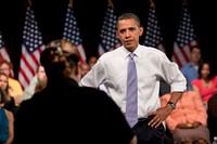 President Barack Obama listens to a question from a person in the audience at the Organizing for America National Health Care Forum held at the Democratic National Committee Headquarters in Washington, D.C., Aug. 8, 2009.