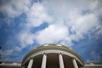 The sky is seen above the Truman Balcony of the White House. Original public domain image from Flickr