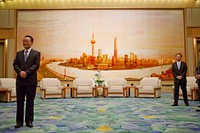 China's National People's Congress Chairman Wu Bangguo, left, waits to greet President Barack Obama before a meeting at the Great Hall of the People in Beijing,China, Nov. 17, 2009.