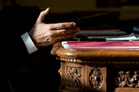 President Barack Obama gestures while talking on the phone Oval Office prior to leaving for his speech at West Point, Dec. 1, 2009