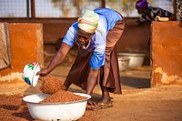 USAID in Ghana: Shea Butter Processing. USAID and the Global Shea Alliance partner to connect West Africa village women to the global marketplace. Photo: Douglas Gritzmacher/USAID. Original public domain image from Flickr