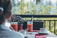 Woman having breakfast at hotel. Free public domain CC0 photo.