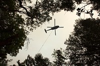 Heli Water Drop Operations, Helicopter Operations collecting water from a popular swimming hole near Shan Creek to suppress the Taylor Creek Fire. Credit: Darren Stebbins 7-27-18. Original public domain image from Flickr