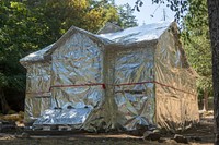 Historic Store Gulch wrapped in Kevlar foil, Taylor Creek and Klondike Fires, Rogue-Siskiyou NF, OR, 2018 (Photo by Kari Greer). Original public domain image from Flickr