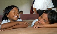 Enthusiastic children in class. Photo by USAID. Every child should want to learn. Setiap anak pasti ingin belajar. Original public domain image from Flickr