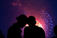 President Barack Obama and First Lady Michelle Obama watch the fireworks over the National Mall from the roof of the White House, July 4, 2010.