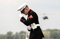 President Trump Returns to D.C.A U.S. Marine holds on to his hat as Marine One approaches for landing Sunday, Aug. 18, 2019, at Morristown Municipal Airport in Morristown, N.J. (Official White House Photo by Joyce N. Boghosian). Original public domain image from Flickr
