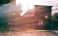 Old closed wooden store with sunlight. Free public domain CC0 photo.