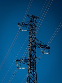 Power lines on electric transmission at night. Free public domain CC0 photo.