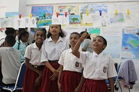 Students in class. Cintai lautku Anak-anak antusias belajar tentang keanekaragaman hayati lautan saat kegiatan Pekan Penyu di Manokwari. Photo courtesy of University of Papua for USAID. Original public domain image from Flickr