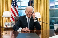 President Joe Biden talks on the phone with Katherine Tai in the Oval Office of the White House Thursday, March 18, 2021, to congratulate her on her confirmation as U.S. Trade Representative. (Official White House Photo by Adam Schultz). Original public domain image from Flickr