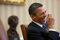 President Barack Obama laughs during a meeting in the Oval Office, Jan. 24, 2011.