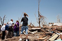 President Barack Obama talks with residents during a tour of neighborhoods impacted by the deadly tornado in Joplin, Mo., May 29, 2011.