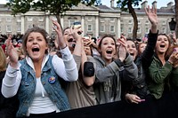 People cheer as President Barack Obama and First Lady Michelle Obama are introduced during an Irish celebration at College Green in Dublin, Ireland, May 23, 2011.