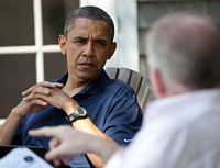 President Barack Obama receives a national security briefing from John Brennan, Assistant to the President for Homeland Security, in Chilmark, Mass., Aug. 19, 2011.