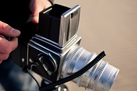 Photographer with analog camera. Free public domain CC0 image.