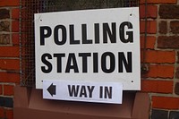 Polling station entrance sign. Original public domain image from Flickr