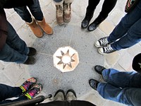 Friends standing together in circle. Free public domain CC0 photo.