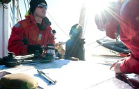 ATLANTIC OCEAN -- Crewmembers and officer candidates chart a course aboard Coast Guard Cutter Eagle March 9, 2013. The officer candidates spent two weeks aboard the Eagle during their 17-week course to further develop their seamanship, teamwork and leadership skills. U.S. Coast Guard photo by Petty Officer 3rd Class Cory J. Mendenhall. Original public domain image from Flickr