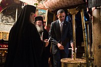 President Barack Obama lights candles as he tours the crypt containing the birthplace of Jesus during his visit to the Church of the Nativity in Bethlehem, the West Bank, March 22, 2013.