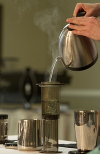 Barista making aeropress coffee. Free public domain CC0 photo.