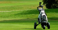 Golf cart bag on grass field. Free public domain CC0 image. 