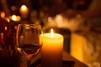 Glass of wine and candle. Free public domain CC0 photo.