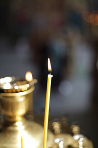 Candle lit for prayer. Free public domain CC0 image.