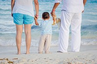 Family at the beach. Free public domain CC0 photo.