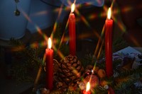 Burning red candles in the dark. Free public domain CC0 image.