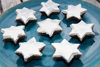 Closeup on star cookies with white frosting. Free public domain CC0 image.