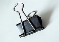 Black metal paper clip. stationery. Free public domain CC0 image.