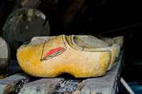 Yellow clogs on a shelf. Free public domain CC0 image.