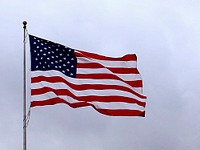 American flag waving against sky. Free public domain CC0 photo.