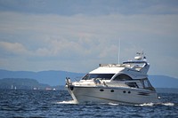 Yacht sailing in the sea. Free public domain CC0 photo.