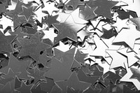 Pile of silver star confetti decoration. Free public domain CC0 image.
