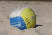 Closeup on volleyball in sand. Free public domain CC0 photo.