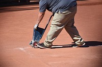 Baseball court maintenance. Free public domain CC0 photo.