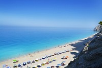 Parasols by beach, background photo. Free public domain CC0 image.