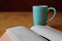 Reading a book with morning coffee. Free public domain CC0 image.