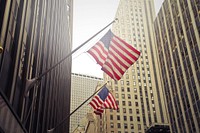 Free American flag in cityscape image, public domain CC0 photo.